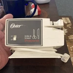 Oster Electric Knife & Scissor Sharpener 511-06b White Plastic. Fixed Price $9.75.