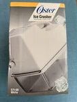 New Sealed Oster 571-08 Ice Crusher White With Dual Settings Course Or Fine. Fixed Price $70.00.